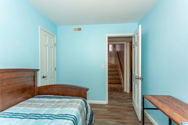 bedroom featuring dark wood-type flooring