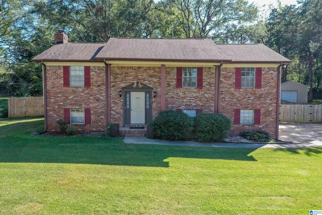 bi-level home with a front yard