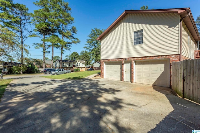 view of property exterior featuring a garage