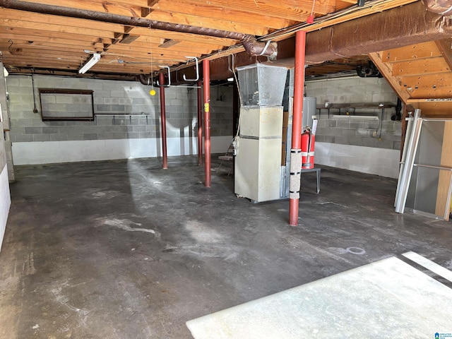 basement with gas water heater and heating unit