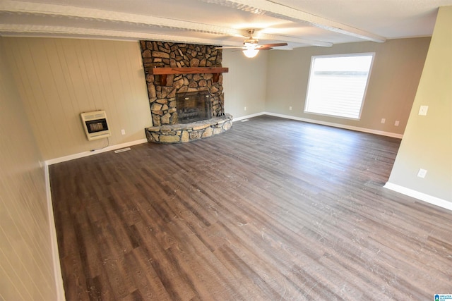 unfurnished living room featuring beam ceiling, a fireplace, heating unit, and hardwood / wood-style flooring