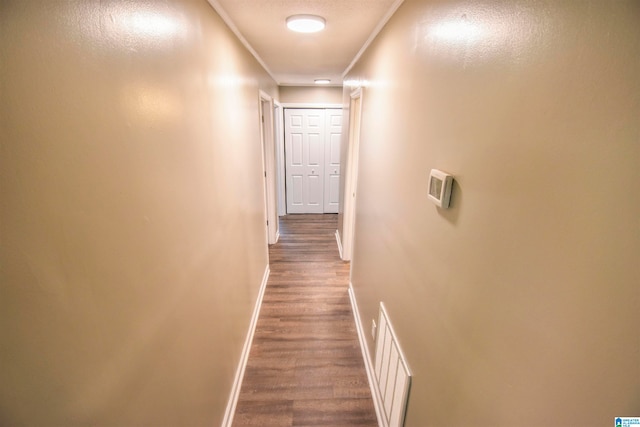 hall featuring crown molding and wood-type flooring