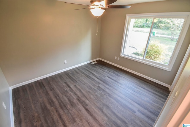 unfurnished room featuring ceiling fan and dark hardwood / wood-style floors