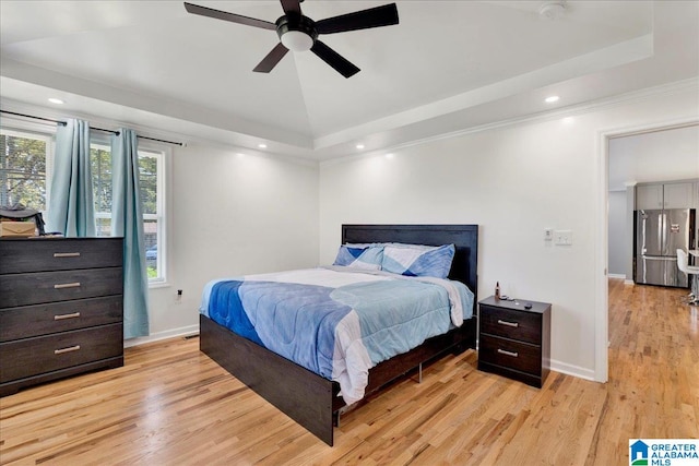 bedroom with ornamental molding, ceiling fan, light hardwood / wood-style floors, lofted ceiling, and stainless steel refrigerator