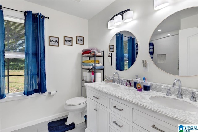 bathroom featuring vanity, toilet, and tile patterned floors