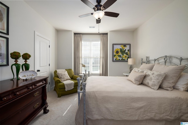 bedroom with light carpet and ceiling fan