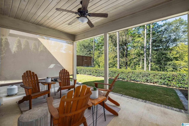 sunroom with wood ceiling and ceiling fan