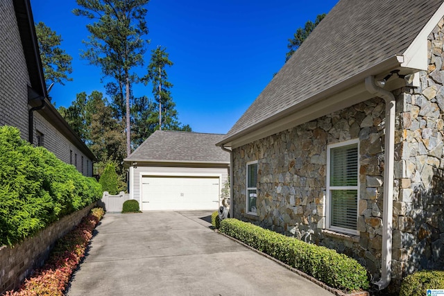 view of side of property with a garage