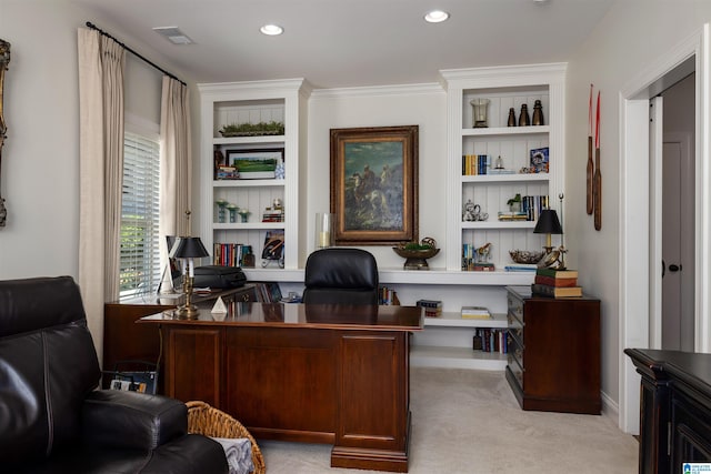 carpeted office featuring ornamental molding and built in features