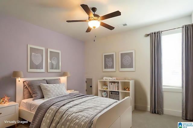 carpeted bedroom featuring ceiling fan