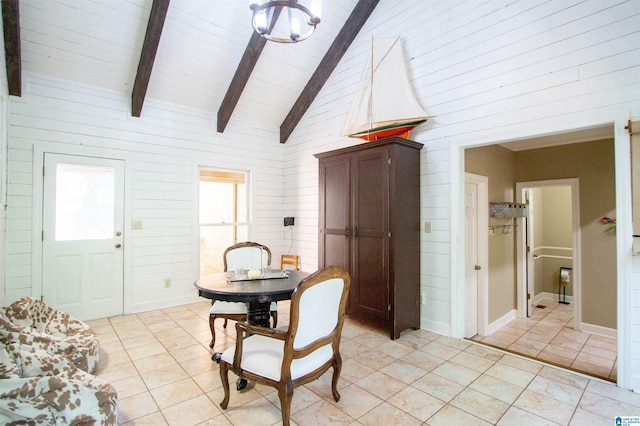 dining room with beamed ceiling, high vaulted ceiling, and light tile patterned floors