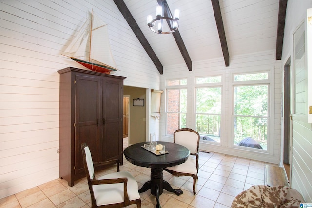 sunroom / solarium with an inviting chandelier and vaulted ceiling with beams