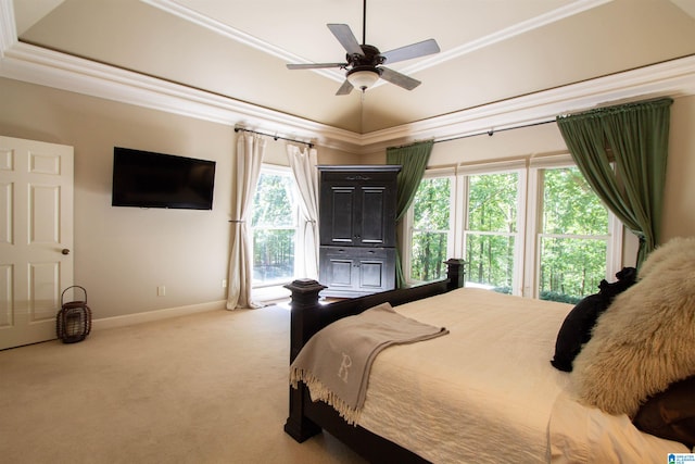 carpeted bedroom with crown molding and ceiling fan