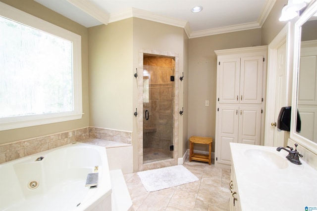 bathroom with vanity, ornamental molding, and shower with separate bathtub