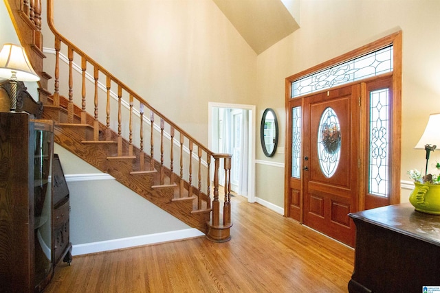 entrance foyer featuring hardwood / wood-style floors and a high ceiling