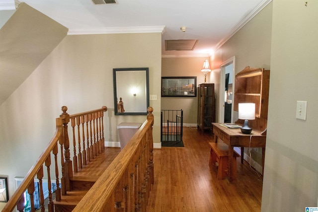 corridor featuring crown molding and hardwood / wood-style floors