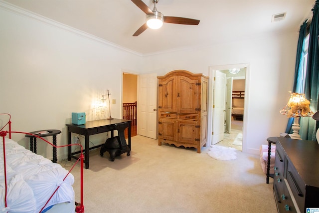 bedroom with a walk in closet, ceiling fan, ornamental molding, a closet, and light colored carpet