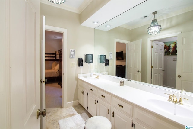 bathroom with vanity, ornamental molding, and tile patterned floors