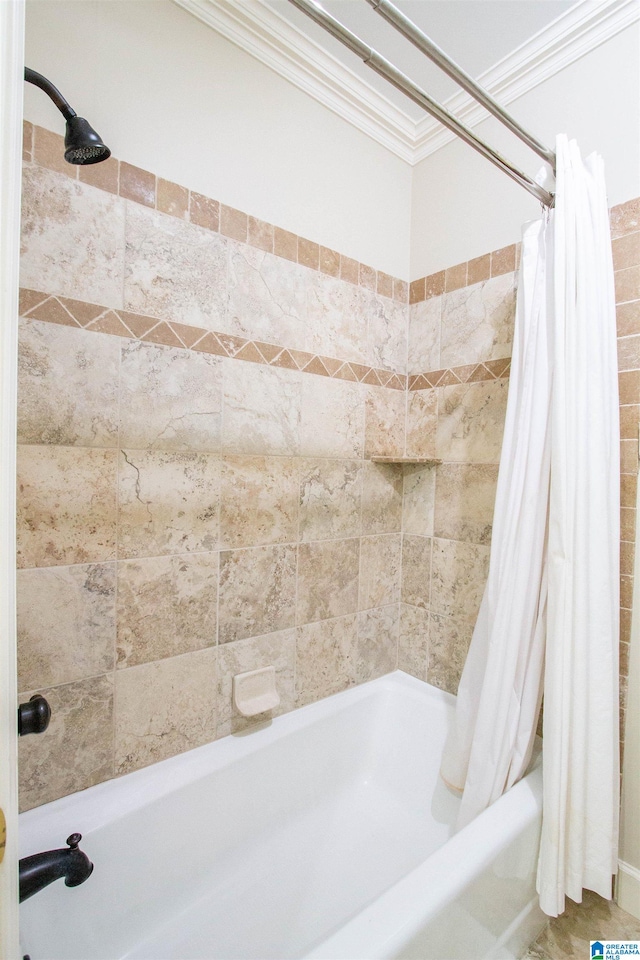 bathroom featuring crown molding and shower / bath combo