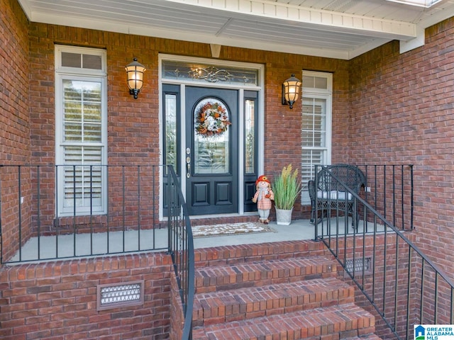 doorway to property with a porch