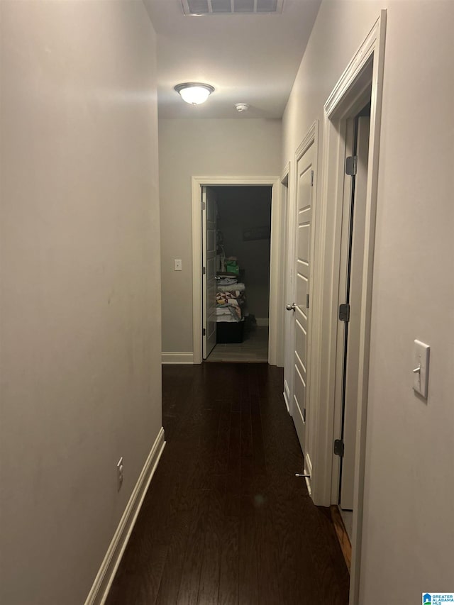 hallway featuring dark hardwood / wood-style floors