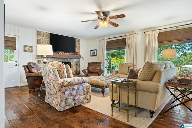 living room with ceiling fan and dark hardwood / wood-style floors