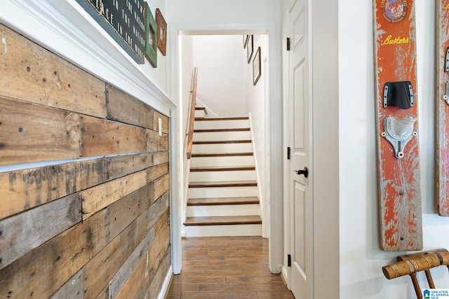 staircase featuring wood-type flooring