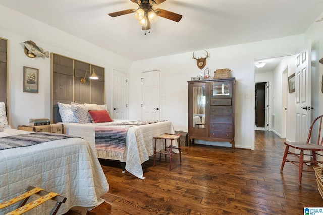 bedroom with dark wood-type flooring and ceiling fan