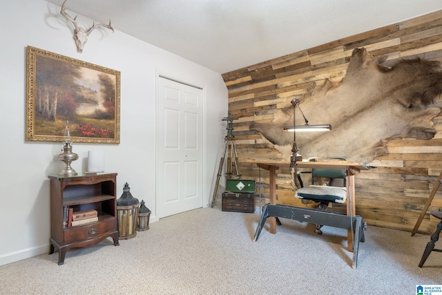 interior space featuring light carpet and wooden walls