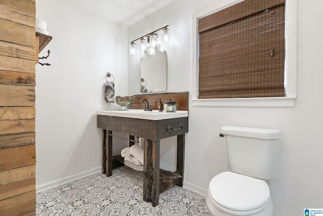 bathroom featuring tile patterned floors and toilet