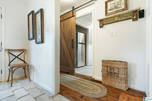 hallway featuring a barn door