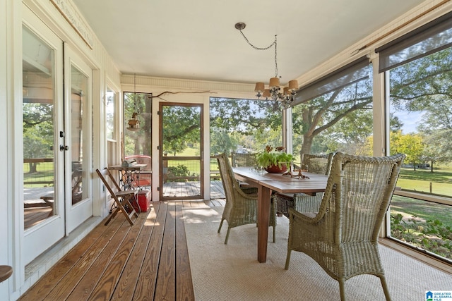 sunroom with a notable chandelier