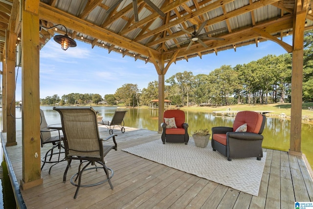 wooden terrace with a gazebo, a water view, and ceiling fan