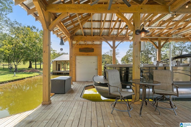 view of dock featuring a deck with water view