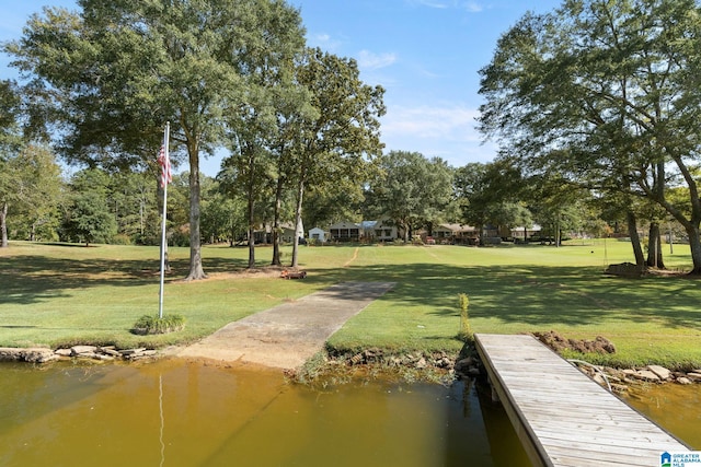 dock area featuring a yard and a water view