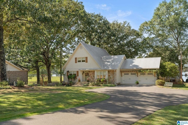 view of front facade with a garage and a front yard