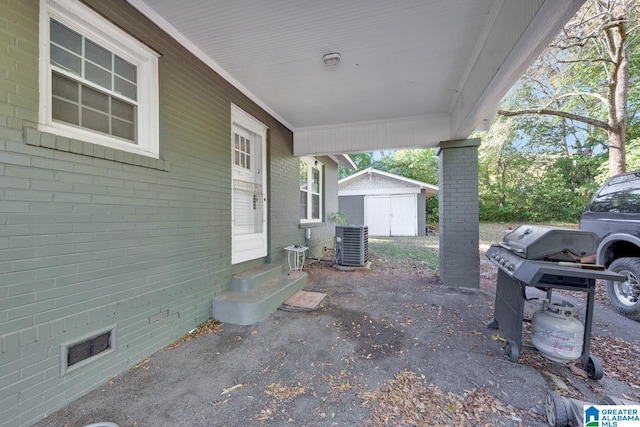 view of patio with a shed and central AC unit