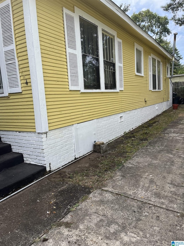 1244 15th St, Birmingham, AL 35211 - view of property exterior with crawl space