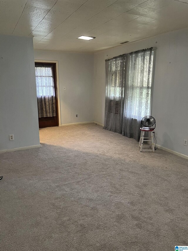 1244 15th St, Birmingham, AL 35211 - empty room featuring carpet and baseboards