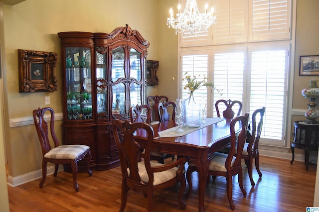 dining space featuring a notable chandelier and hardwood / wood-style flooring