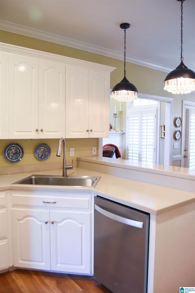 kitchen with sink, dishwasher, hardwood / wood-style floors, and white cabinets