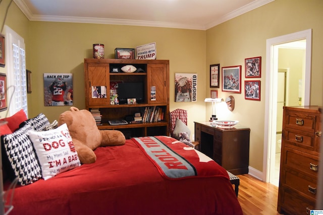 bedroom featuring light hardwood / wood-style floors and ornamental molding