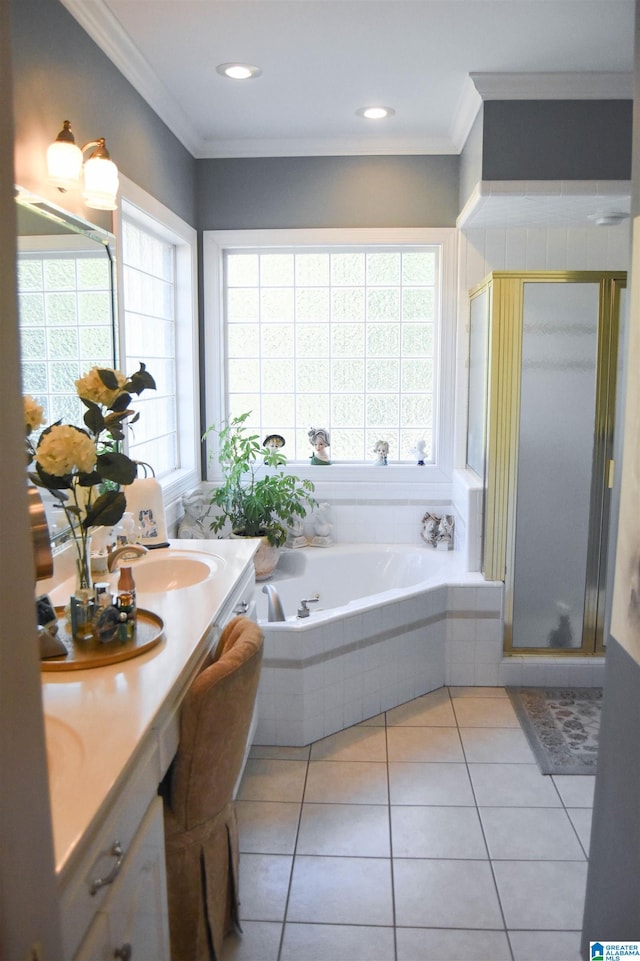 bathroom featuring vanity, shower with separate bathtub, ornamental molding, and tile patterned floors