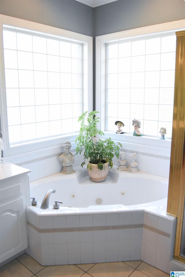 bathroom featuring vanity, tiled bath, and tile patterned floors