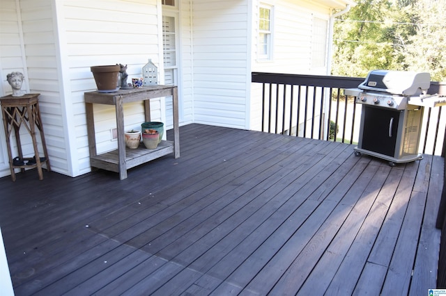 wooden terrace with area for grilling