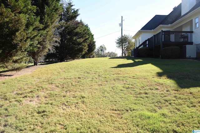 view of yard with a wooden deck