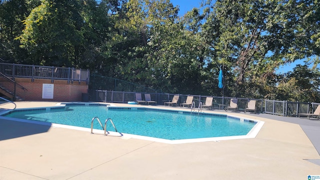 211 Morning Sun Dr Unit 211, Birmingham, AL 35242 - community pool with fence, a patio area, and view of wooded area