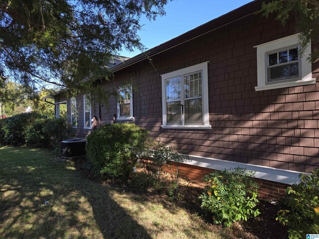 view of property exterior featuring a yard