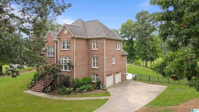 view of home's exterior featuring a yard and a garage