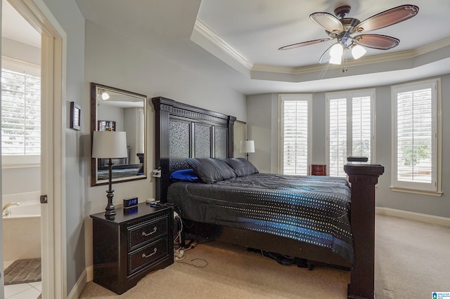 bedroom with ceiling fan, light carpet, and a raised ceiling